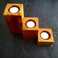 Handcrafted set of 3 candle holders made of Natural mahogany wood is a perfect way to make your rooms cozy and beautiful. Wood candle holders placed on a coffee/dining/corner table accents the beauty and brighten the space and make the room more welcoming, calm and peaceful. Rustic decor accessories, gifting for birthday, wedding anniversary, housewarming. Interior decor accessories, home decor accessories, wooden decor, interior decorations, decor during festivals, festive decor, festive home decor