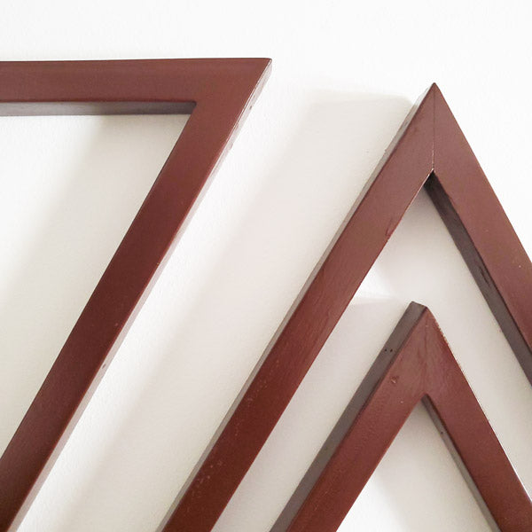 A set of three wooden triangles to hang on the living /dining or bed room wall. The set comes in three different sizes of triangles which could be arranged in multiple ways to suit your style. Made out of pinewood or mahogany gives the décor a beautiful color, and will go well on the walls that is either painted with light colors or dark colors. Triangle is the most significant, because of the inherent power of its form. There are 3 in the set and as number 3 is the most significant of all the numbers.