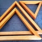 A set of three wooden triangles to hang on the living /dining or bed room wall. The set comes in three different sizes of triangles which could be arranged in multiple ways to suit your style. Made out of pinewood or mahogany gives the décor a beautiful color, and will go well on the walls that is either painted with light colors or dark colors. Triangle is the most significant, because of the inherent power of its form. There are 3 in the set and as number 3 is the most significant of all the numbers.