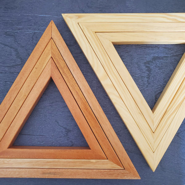 A set of three wooden triangles to hang on the living /dining or bed room wall. The set comes in three different sizes of triangles which could be arranged in multiple ways to suit your style. Made out of pinewood or mahogany gives the décor a beautiful color, and will go well on the walls that is either painted with light colors or dark colors. Triangle is the most significant, because of the inherent power of its form. There are 3 in the set and as number 3 is the most significant of all the numbers. 
