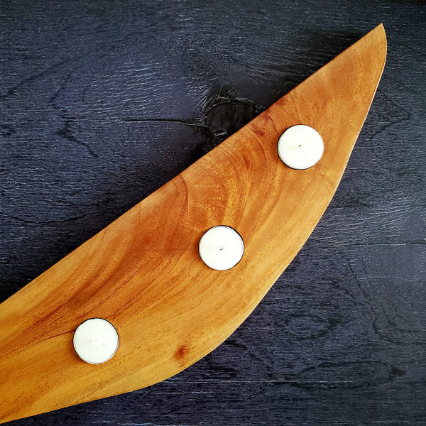 Our handcrafted wooden tealight candle platter made out of mahogany is a perfect way to make your rooms brightened and beautiful.  This is a perfect gifting idea for the coming festive season. Made out of solid wood, the candle holder is strong, durable and the wood design is timeless.