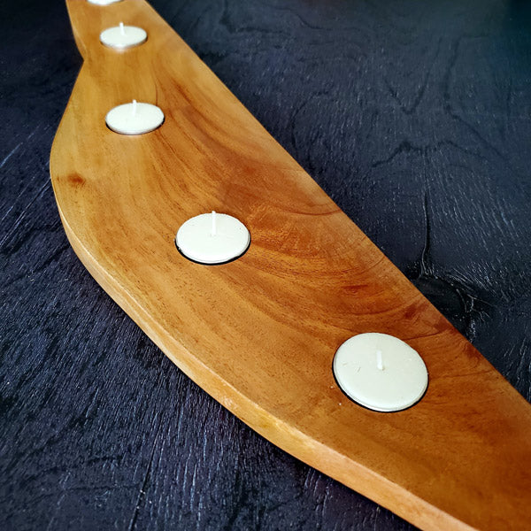 Our handcrafted wooden tealight candle platter made out of mahogany is a perfect way to make your rooms brightened and beautiful.  This is a perfect gifting idea for the coming festive season. Made out of solid wood, the candle holder is strong, durable and the wood design is timeless.