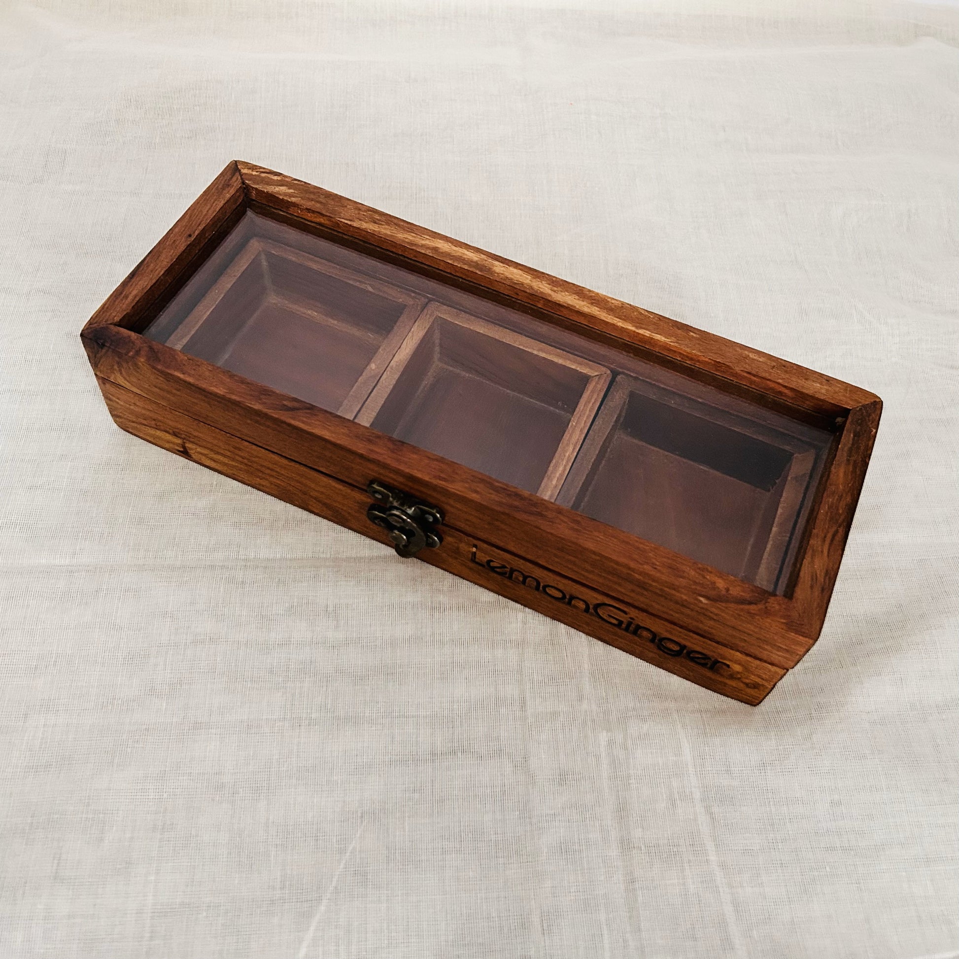 Rectangular Wooden Masala Box, Multi utility wooden box for storage, Dry fruit box, Spice box. Beautiful long rectangular box that has 3 square compartments or wooden square boxes that can be used to store masala, spices, dry fruits, or jewelry, and trinkets. Perfect gift for kids, wife, husband, friends, and all those who love to host, organize and decorate their house. Perfectly designed to add beauty and elegance to your coffee table, teapoy, kitchen, and dining rooms.